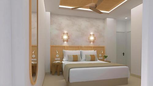 En eller flere senge i et værelse på Hotel Urania Arenal - Adults Recommended