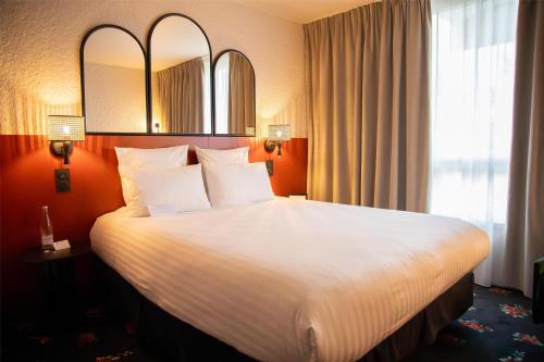 Postel nebo postele na pokoji v ubytování Best Western Porte du Forez