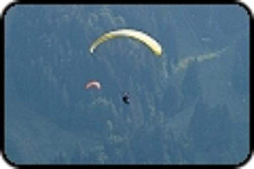 two kites flying in the sky in the sky at B&B Ma Maison Hautes Vosges in Ranspach