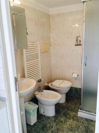 a small bathroom with a toilet and a sink at Appartamenti Baia Smeralda in Santa Marinella