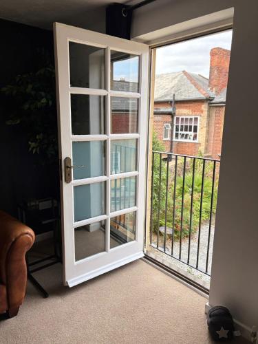 an open door with a view of a balcony at The Flower Loft in Yeovil