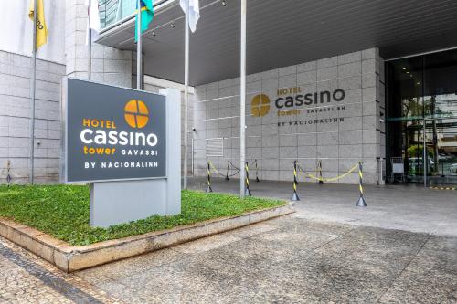 a sign for a hotel casino in front of a building at Cassino Tower Savassi - Próximo a FIEMG in Belo Horizonte