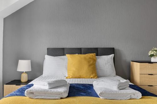 a bedroom with a bed with towels on it at Imperial Plymouth in Plymouth