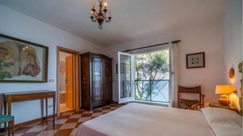 En eller flere senge i et værelse på Villa Il Tramonto Bordo Costa - Goelba
