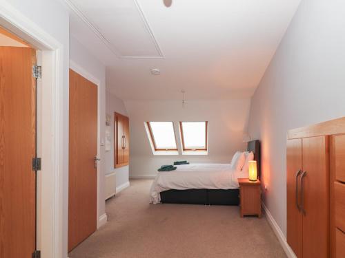 a bedroom with a bed and a window at 1 Windermere in Kinvara