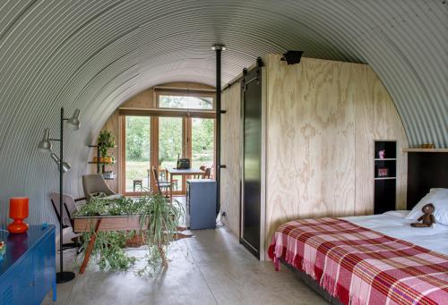 Кровать или кровати в номере Het Lage Noorden