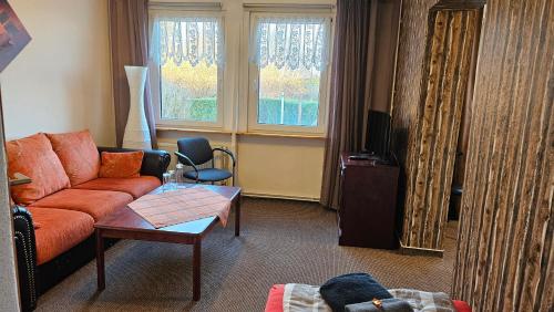 Khu vực ghế ngồi tại Pension Garni Zur Schamper Mühle