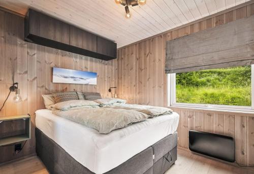 En eller flere senge i et værelse på Exclusive cottage - Ski in ski out!