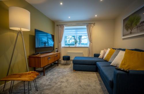 TV a/nebo společenská místnost v ubytování Florence Cottage