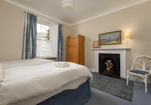 Кровать или кровати в номере Sandy Neuk