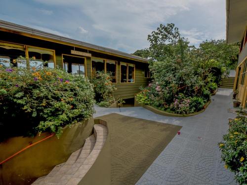 a building with someotted plants in front of it at Hotel Don Taco in Monteverde Costa Rica