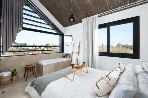 Ένα ή περισσότερα κρεβάτια σε δωμάτιο στο Pamboo Verdea House by Nomads