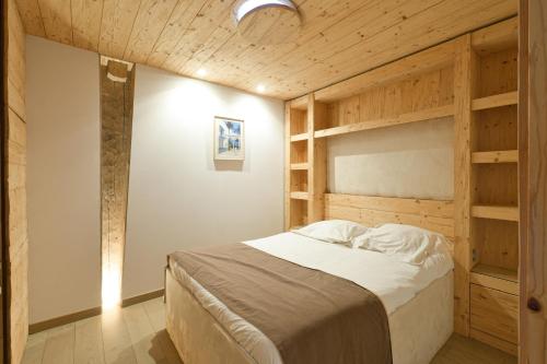 En eller flere senge i et værelse på Appartement Le Jalouvre