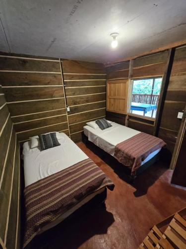 Postel nebo postele na pokoji v ubytování Rustik Cabaña