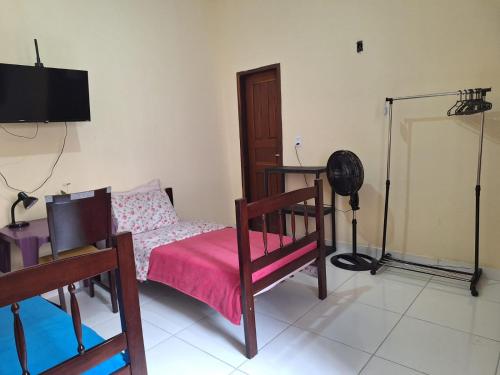 Et tv og/eller underholdning på Suíte perto do Centro e de Praias