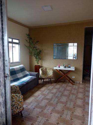 En eller flere senge i et værelse på Cantinho do aconchego