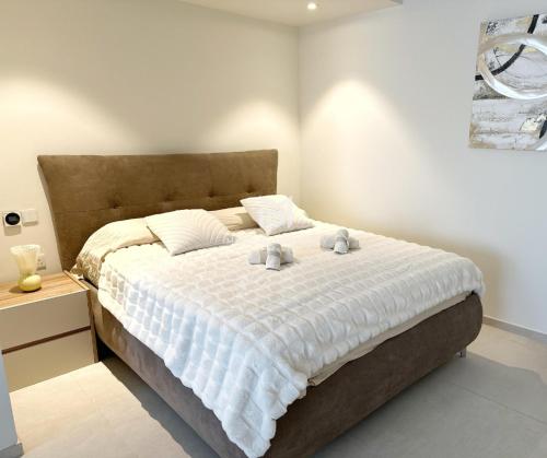 Giường trong phòng chung tại Mercury Suites