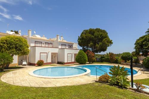 a large house with a swimming pool in the yard at B75 - Casa Delfim in Alfanzina Carvoeiro in Carvoeiro