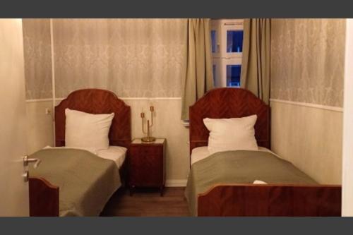 En eller flere senge i et værelse på BoLA Ferienwohnung Hamburg Nr 24 Shabby für 4 Personen, Parkplatz