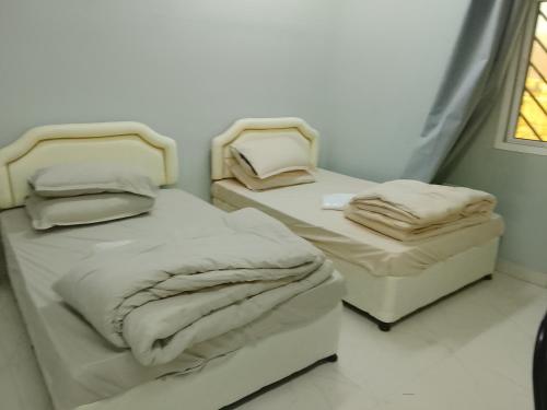 Una cama o camas en una habitación de Al Hamra in Oman