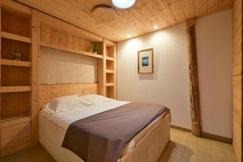 En eller flere senge i et værelse på Appartement Le Lachat