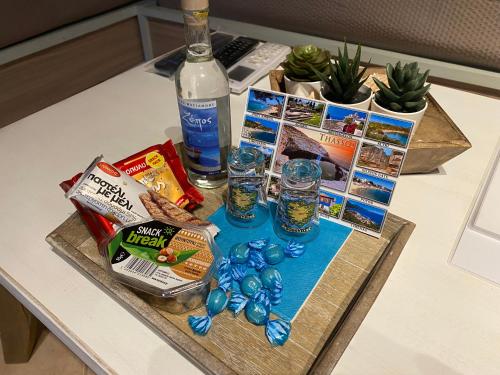 a table with a tray of food and drinks on it at SUNNY STUDIO in Skala Marion