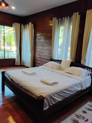 Ένα ή περισσότερα κρεβάτια σε δωμάτιο στο Huan Janto Homestay - Ubekkha