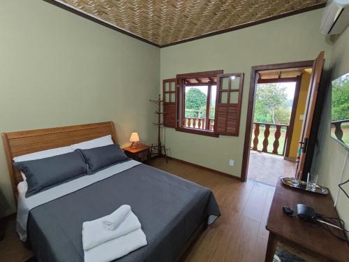 Postel nebo postele na pokoji v ubytování Recanto do Sitio