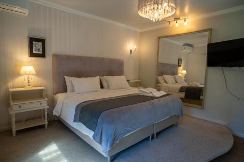 En eller flere senge i et værelse på Vivares Pousada Boutique Gramado