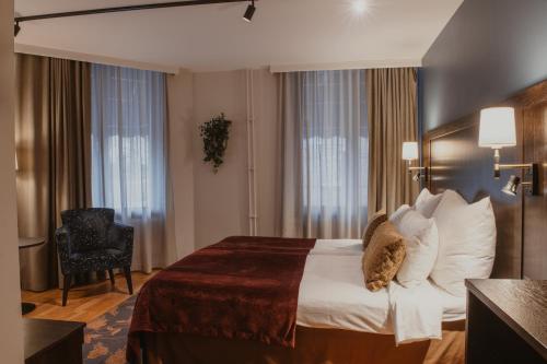 Postel nebo postele na pokoji v ubytování Home Hotel Kung Oscar