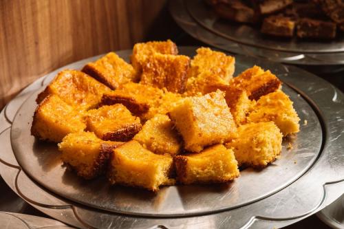 a glass plate with some food on a table at Angra Beach Hotel in Angra dos Reis