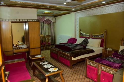 Postel nebo postele na pokoji v ubytování Hotel Ambassador