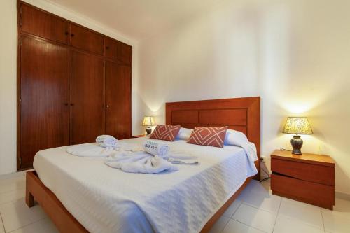 Postel nebo postele na pokoji v ubytování B98 - Rio a Vista Praia da Rocha Apartment