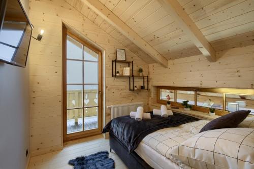 Postel nebo postele na pokoji v ubytování Domki Pod Łanem