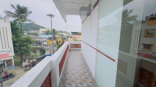 a balcony of a building with a view of a city at Hotel Anbu Airport in Chennai