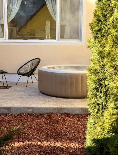 a bench sitting in front of a building at The Bucket - Calla Old Town House with Jacuzzi & View in Braşov