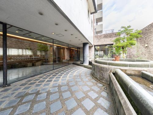 an external view of a building with a courtyard at APA Hotel Kanazawa Nomachi in Kanazawa