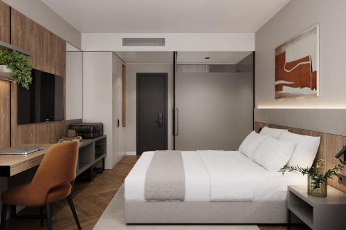 Postel nebo postele na pokoji v ubytování Hotel Metropol