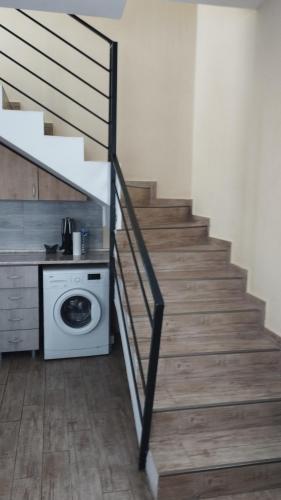 a staircase with a washing machine in a room at bakuriani in Bakuriani