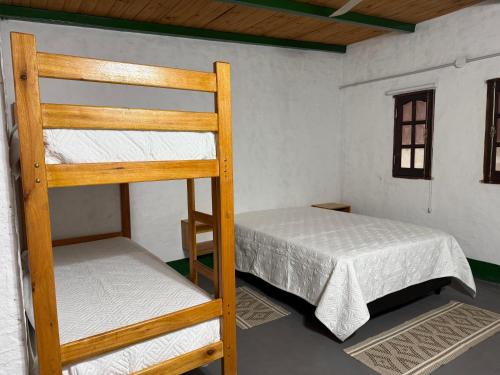 Postel nebo postele na pokoji v ubytování El Cacique Host