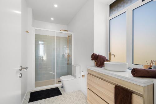 a bathroom with a sink and a toilet and a shower at Casa NOLA by Susys Holidays in Funchal