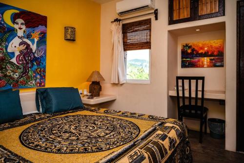 Postel nebo postele na pokoji v ubytování Ceiba Studios