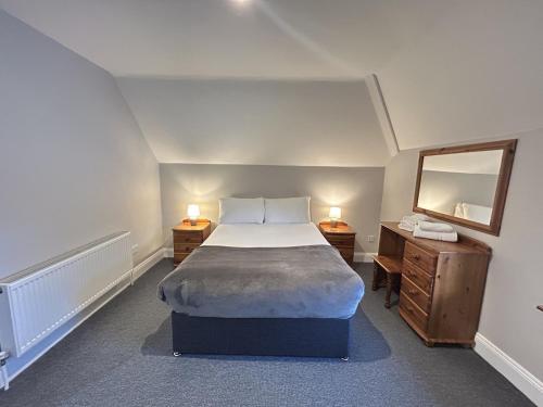 Postel nebo postele na pokoji v ubytování The Robins Rest