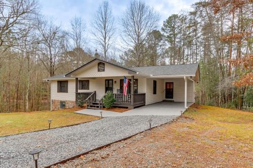 a white house with a porch and a driveway at 2 Mi to Lake Blue Ridge Yellowbird Cottage in Blue Ridge