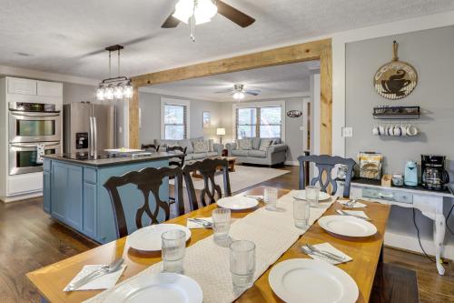 a kitchen and living room with a table and chairs at 2 Mi to Lake Blue Ridge Yellowbird Cottage in Blue Ridge