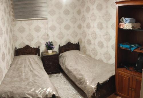 En eller flere senge i et værelse på Buzovna Deluxe Yard