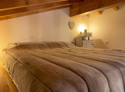 Кровать или кровати в номере Casinha do Forno T0 - Casinhas de Trás das Eiras