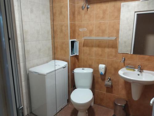 a bathroom with a toilet and a sink at Sea view in Sozopol