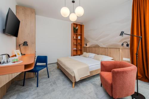 TV a/nebo společenská místnost v ubytování Le Petit