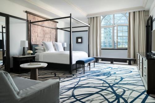 a hotel room with a bed and a couch at Four Seasons Hotel Mexico City in Mexico City